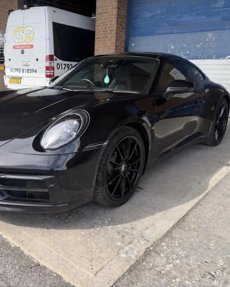 Black Porsche 911 Carrera 4 after a full black pack