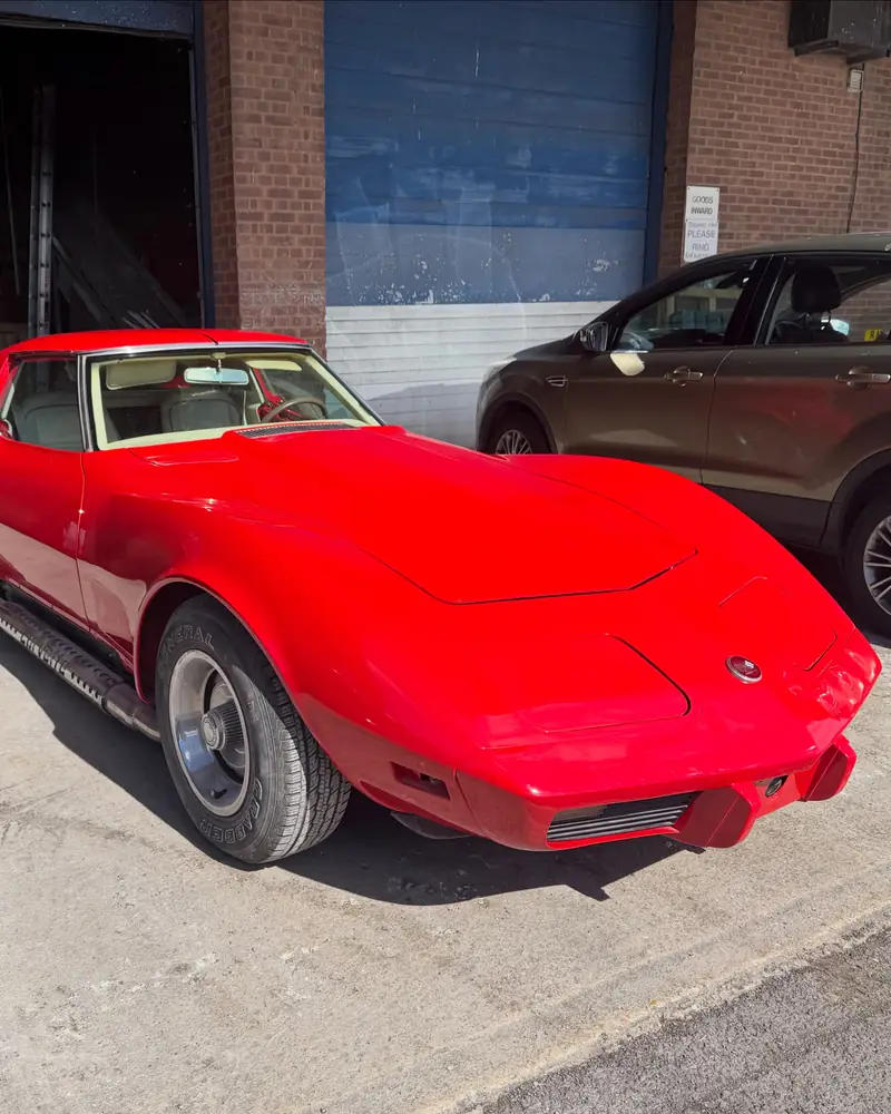 Red Chevrolet Corvette Stingray after a full respray in Ford Radiant Red