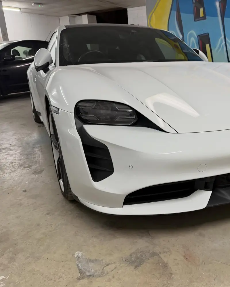 White Porsche Taycan Turbo after a front bumper repair